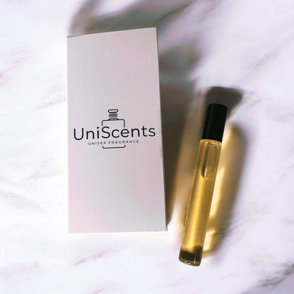 A 10ml rollerball perfume bottle with a gold-colored liquid, next to its white packaging that reads 'UniScents Unisex Fragrance'.